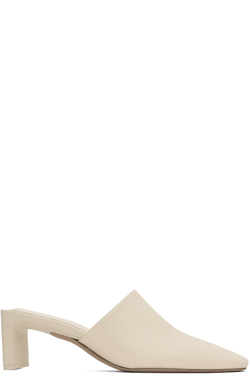 Buffed leather mules in off-white. 

· Pointed square toe
· Logo-embossed padded leather footbed
· Rubberized logo patch at heel
· Covered heel with rubber injection 
· Leather sole 
· Heel: H2.5"

Supplier color: Cement
