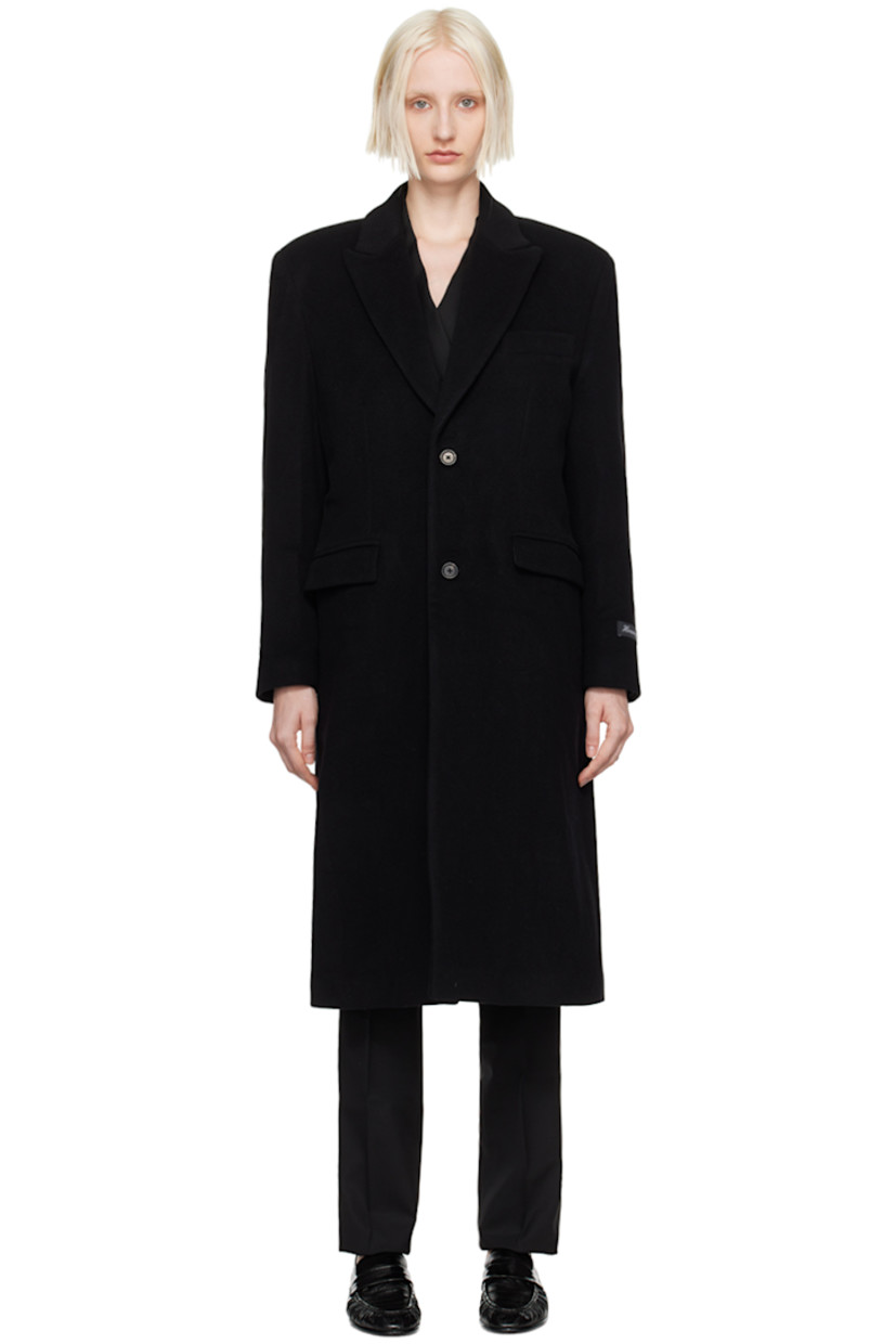 Oversized wool-blend melton coat. 

· Peaked lapel
· Button closure
· Welt pocket
· Flap pockets 
· Padded shoulders
· Logo patch at cuff
· Central vent at back hem
· Welt pocket at interior
· Full viscose satin lining 

Supplier color: Black