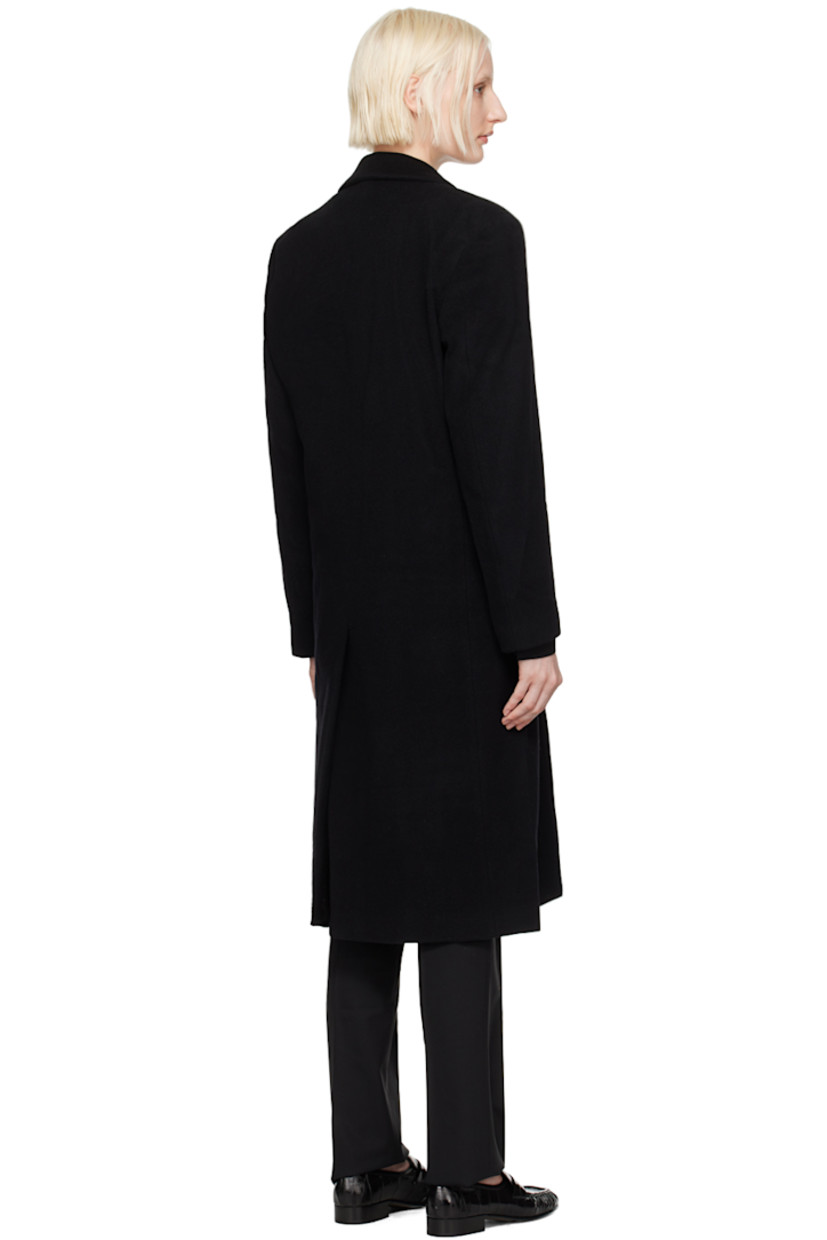 Oversized wool-blend melton coat. 

· Peaked lapel
· Button closure
· Welt pocket
· Flap pockets 
· Padded shoulders
· Logo patch at cuff
· Central vent at back hem
· Welt pocket at interior
· Full viscose satin lining 

Supplier color: Black