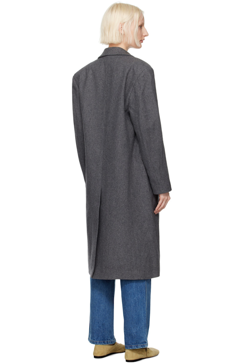 Wool-blend melton coat. 

· Peaked lapel
· Button closure
· Welt pocket 
· Flap pockets 
· Padded shoulders
· Logo patch at cuff
· Central vent at back hem 
· Welt pocket at interior
· Full viscose satin lining 

Supplier color: Charcoal