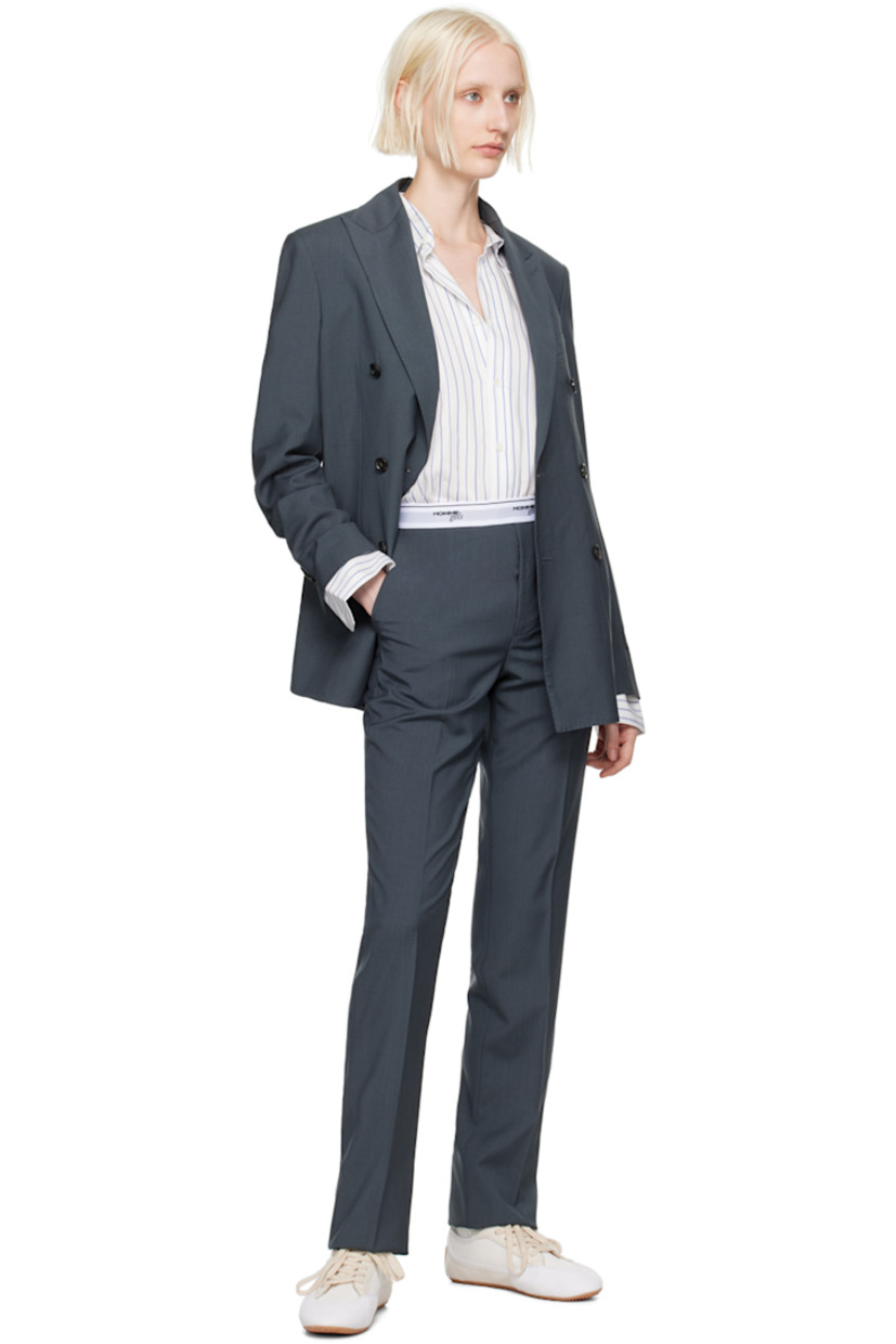 Wool twill trousers. 

· Logo-woven elasticized waistband 
· Four-pocket styling 
· Button-fly 
· Creased legs
· Zip closure at outseam 
· Unlined 

Supplier color: Gray