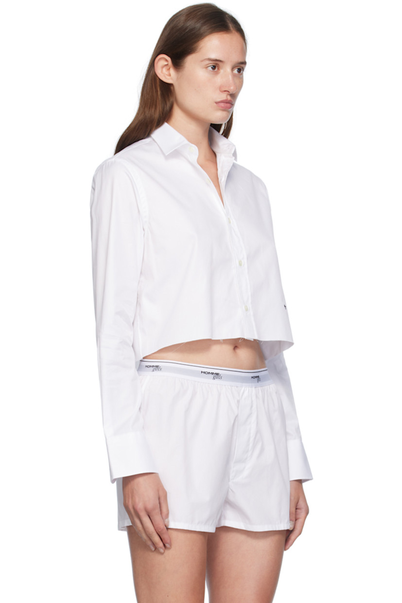 Cotton twill shirt. 

· Spread collar
· Button closure
· Logo embroidered at front
· Raw edge at cropped hem
· Adjustable single-button barrel cuffs
· Box pleat at back yoke

Supplier color: White
