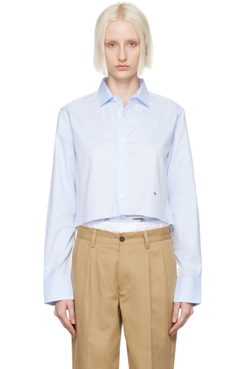 Cotton twill shirt.

· Spread collar
· Button closure
· Logo embroidered at front
· Raw edge at cropped hem
· Adjustable single-button barrel cuffs
· Box pleat at back yoke

Supplier color: Chambray blue
