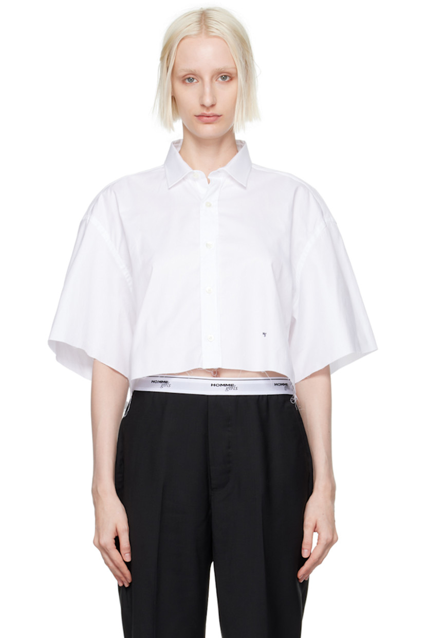 Oversized cotton twill shirt.

· Spread collar
· Button closure
· Logo embroidered at front
· Raw edge at cropped hem and cuffs
· Box pleat at back yoke

Supplier color: White