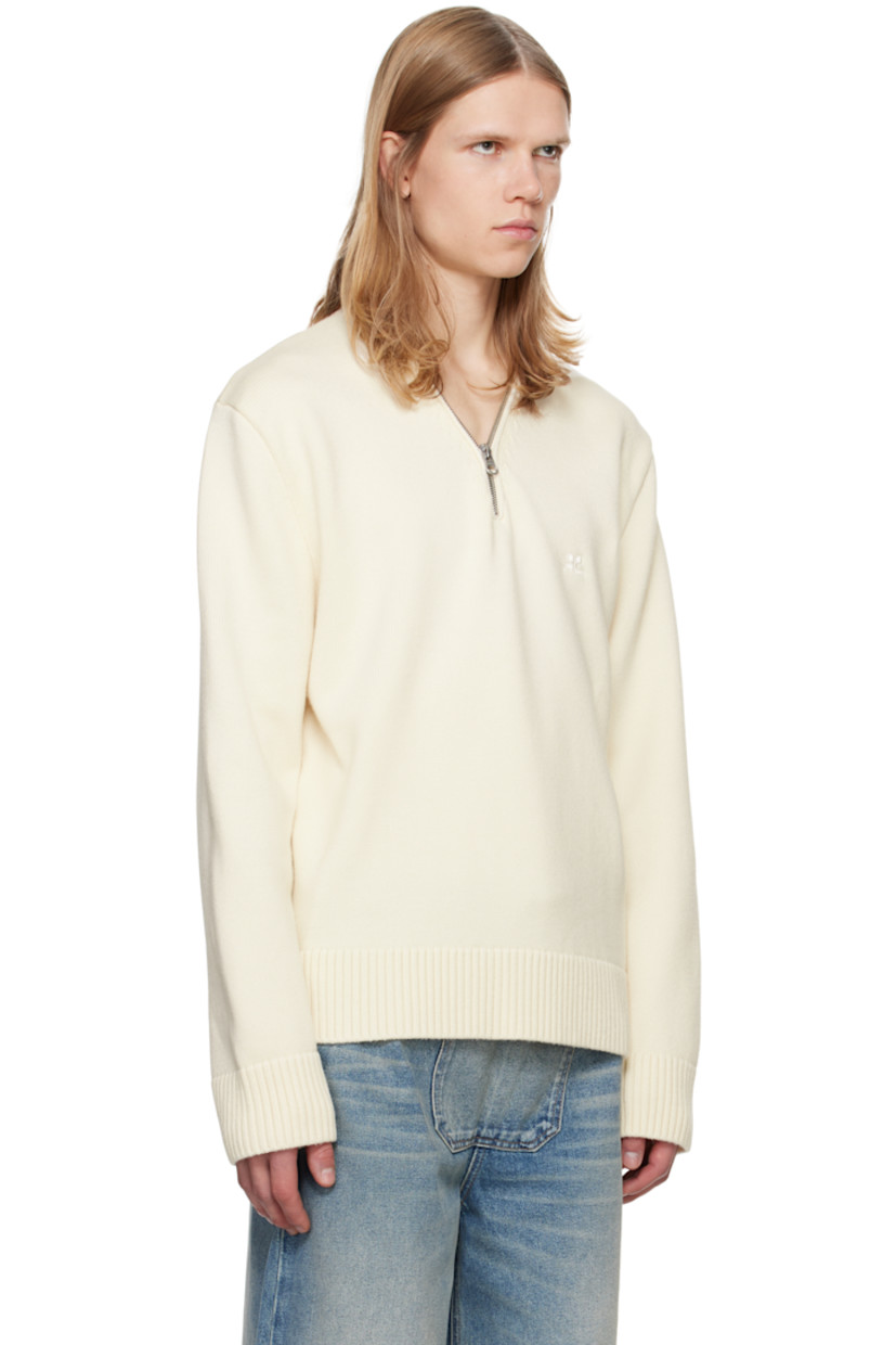 Knit merino wool sweater. 

· V-neck 
· Zip closure at collar
· Embroidered logo patch at chest 
· Rib-knit hem and cuffs
· Silver-tone hardware 

Supplier color: Natural beige