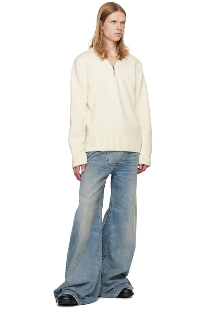 Knit merino wool sweater. 

· V-neck 
· Zip closure at collar
· Embroidered logo patch at chest 
· Rib-knit hem and cuffs
· Silver-tone hardware 

Supplier color: Natural beige