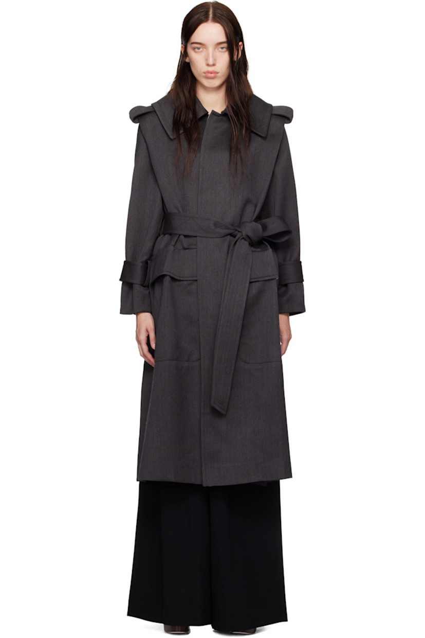 Wool gabardine trench coat.

· Fold-down collar
· Detachable buttoned throat guard
· Self-tie belt at waist
· Flap pockets at front
· Epaulets
· Integrated belt at cuffs
· Vented at side seam and back
· Storm flap
· Partial satin lining

Supplier color: Charcoal