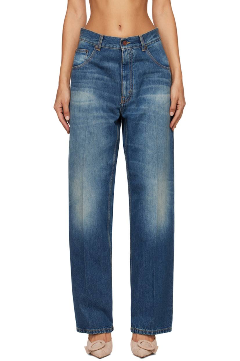 Non-stretch denim jeans. Fading, whiskering, and subtle distressing throughout. 

· Belt loops
· Five-pocket styling
· Zip-fly 
· Creased legs
· Leather logo patch at back waistband
· Logo-engraved antiqued bronze-tone hardware
· Contrast stitching in tan

Supplier color: Heavy vintage med wash