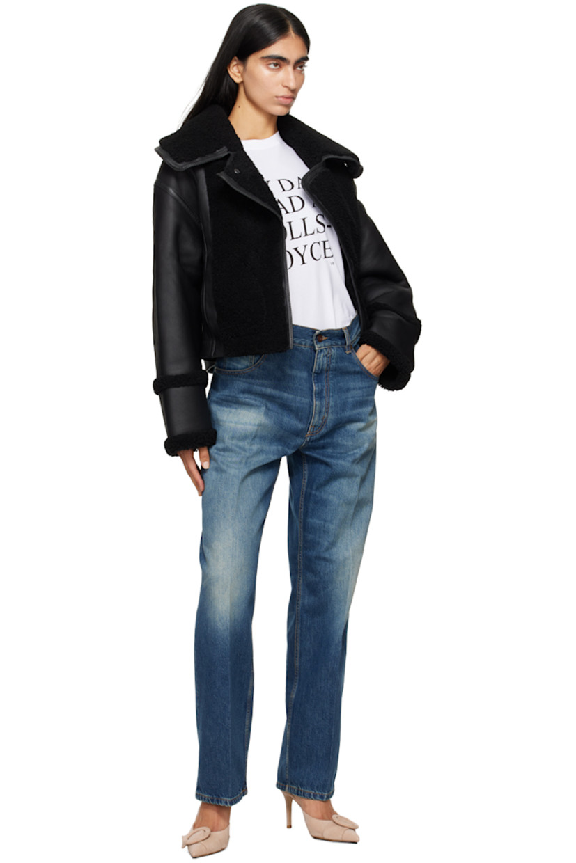 Non-stretch denim jeans. Fading, whiskering, and subtle distressing throughout. 

· Belt loops
· Five-pocket styling
· Zip-fly 
· Creased legs
· Leather logo patch at back waistband
· Logo-engraved antiqued bronze-tone hardware
· Contrast stitching in tan

Supplier color: Heavy vintage med wash