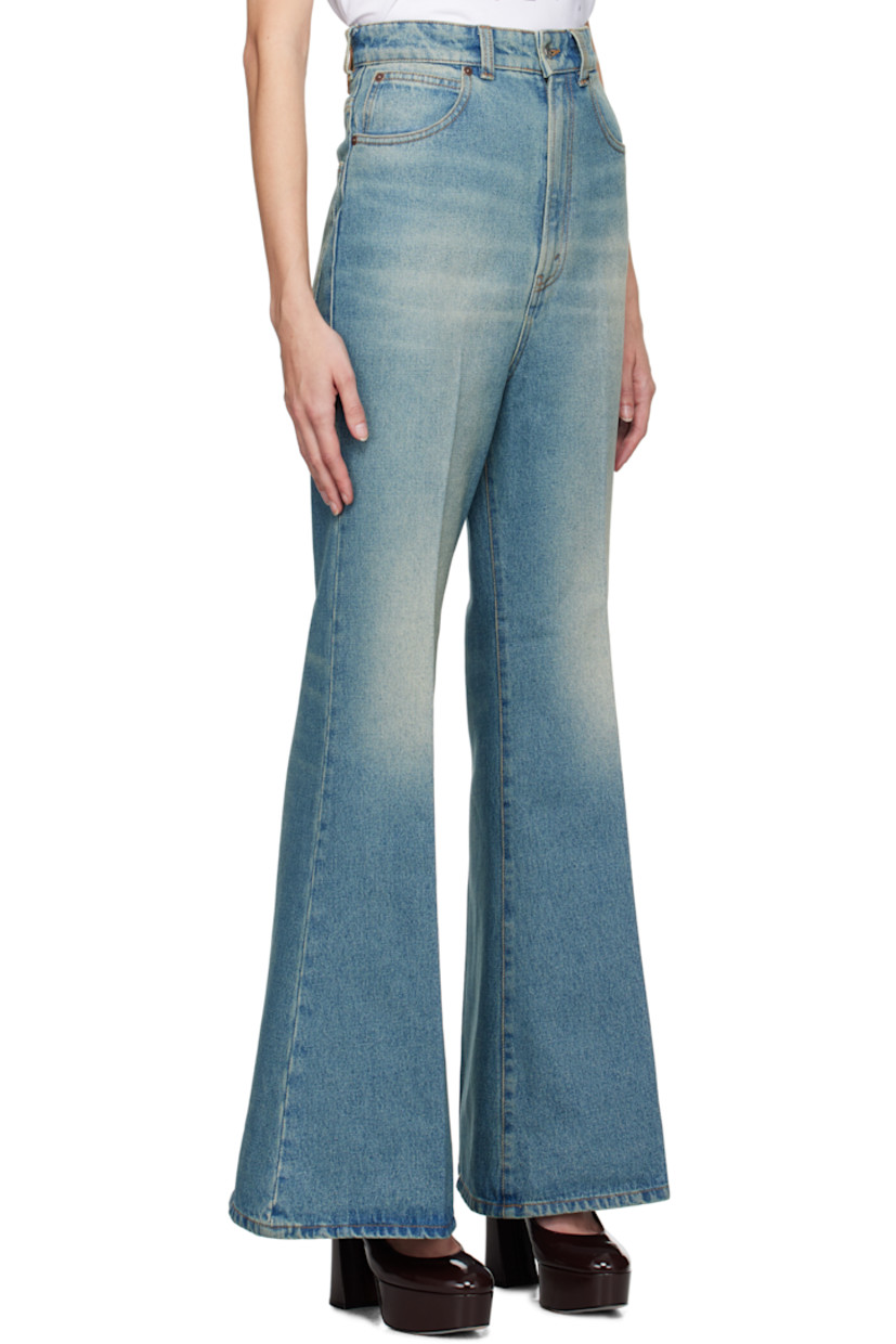 Wide-leg non-stretch denim jeans. Whiskering and fading throughout.

· Garment-dyed
· High-rise
· Belt loops
· Five-pocket styling
· Zip-fly
· Central creases at front and back
· Leather logo patch at back waistband 

Supplier color: Tinted blue wash