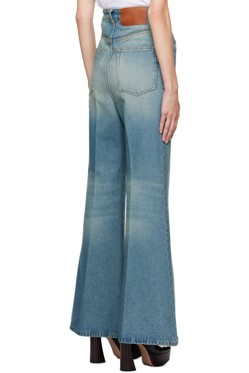 Wide-leg non-stretch denim jeans. Whiskering and fading throughout.

· Garment-dyed
· High-rise
· Belt loops
· Five-pocket styling
· Zip-fly
· Central creases at front and back
· Leather logo patch at back waistband 

Supplier color: Tinted blue wash