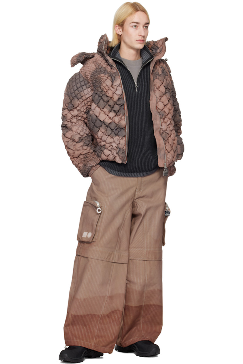 Hand-dyed deadstock plain-woven stretch nylon cargo pants. Reflective stripes and taped seams throughout.

· Bungee-style drawstring at waistband and cuffs
· Four-pocket styling
· Zip fly
· Zip fastening at knees for shorts styling
· Zip bellows pocket at outseams
· Rubber logo patches at outseam

Each item is unique. Please note coloration may vary.

Part of the Charlie Constantinou x 66°North collaboration.

Available exclusively at SSENSE.

Supplier color: C725