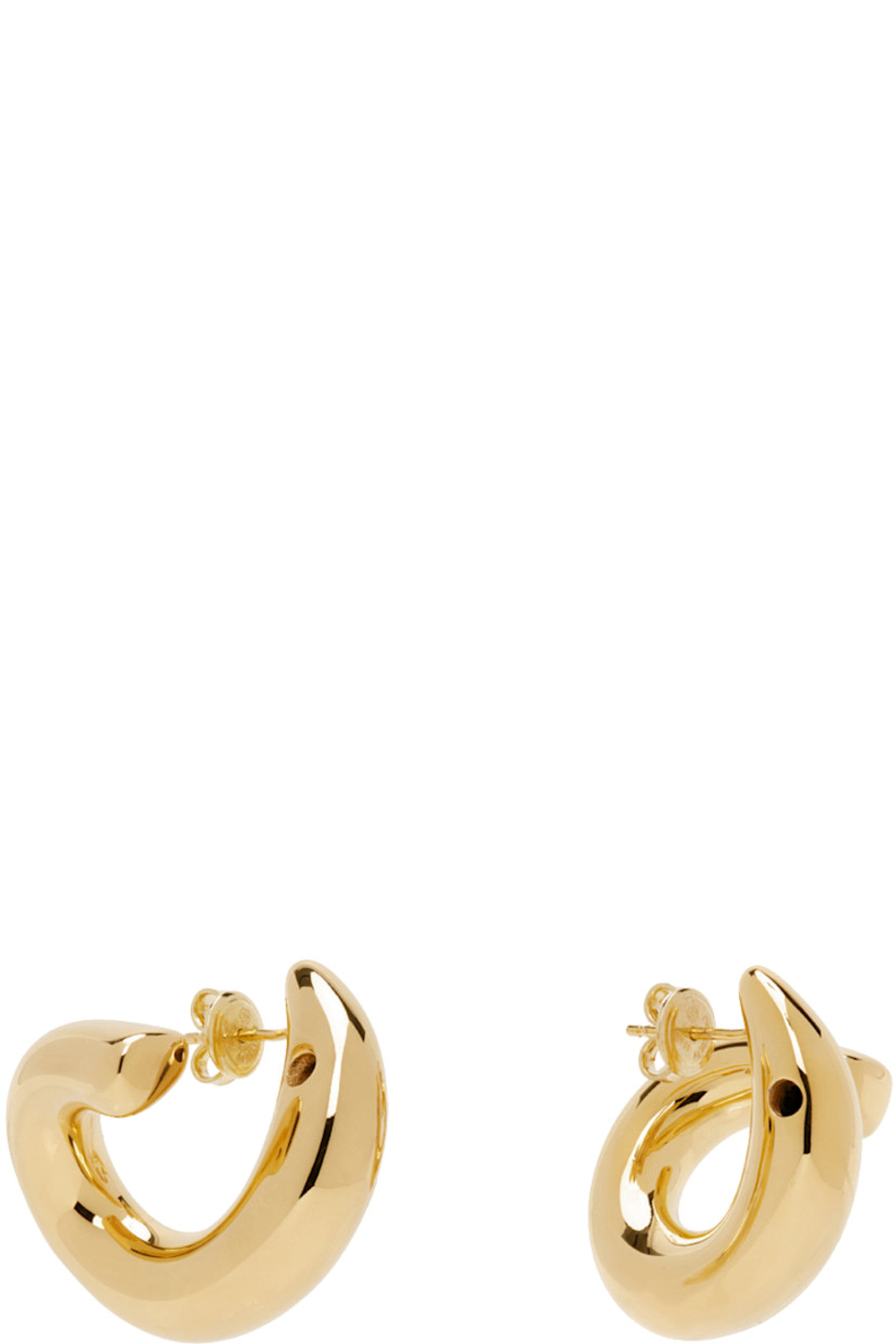 Pair of open hoop earrings in 18k gold-plated sterling silver.

· Post-stud fastening
· D1"

Supplier color: Yellow gold