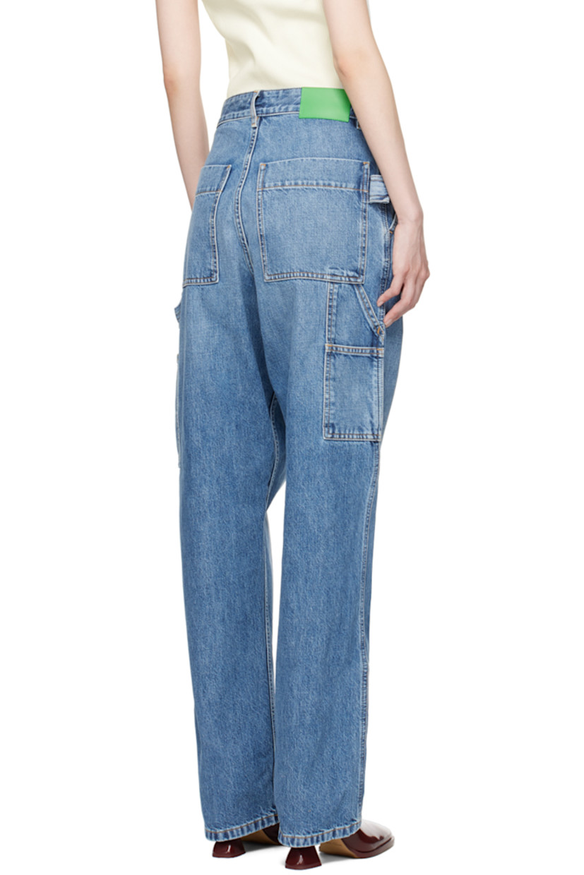 Non-stretch denim jeans. Fading and whiskering throughout. 

· Belt loops
· Five-pocket styling
· Button-fly
· Patch pockets at outseams
· Hammer loop at outseam and back pocket
· Logo patch at back waistband
· Contrast stitching in tan
 
Supplier color: Mid blue