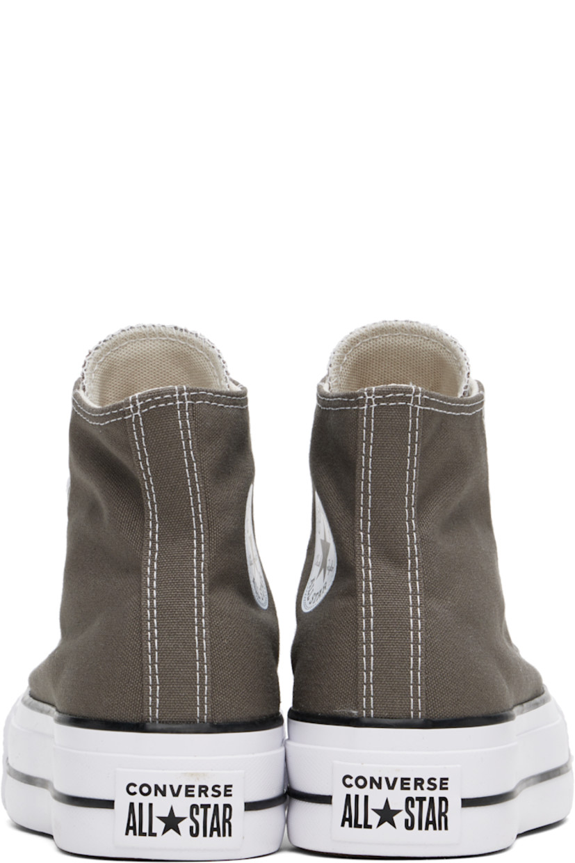 High-top canvas sneakers in gray.

· Rubber cap toe
· Lace-up closure
· Logo patch and eyelets at inner side
· Mesh lining
· OrthoLite cushioning insole
· Logo patch at heel
· Treaded rubber platform sole
· Platform: H1.5"

Supplier color:  Charcoal/White/Black