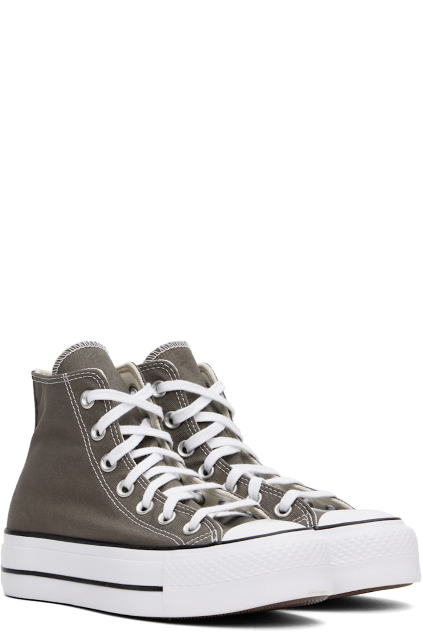 High-top canvas sneakers in gray.

· Rubber cap toe
· Lace-up closure
· Logo patch and eyelets at inner side
· Mesh lining
· OrthoLite cushioning insole
· Logo patch at heel
· Treaded rubber platform sole
· Platform: H1.5"

Supplier color:  Charcoal/White/Black