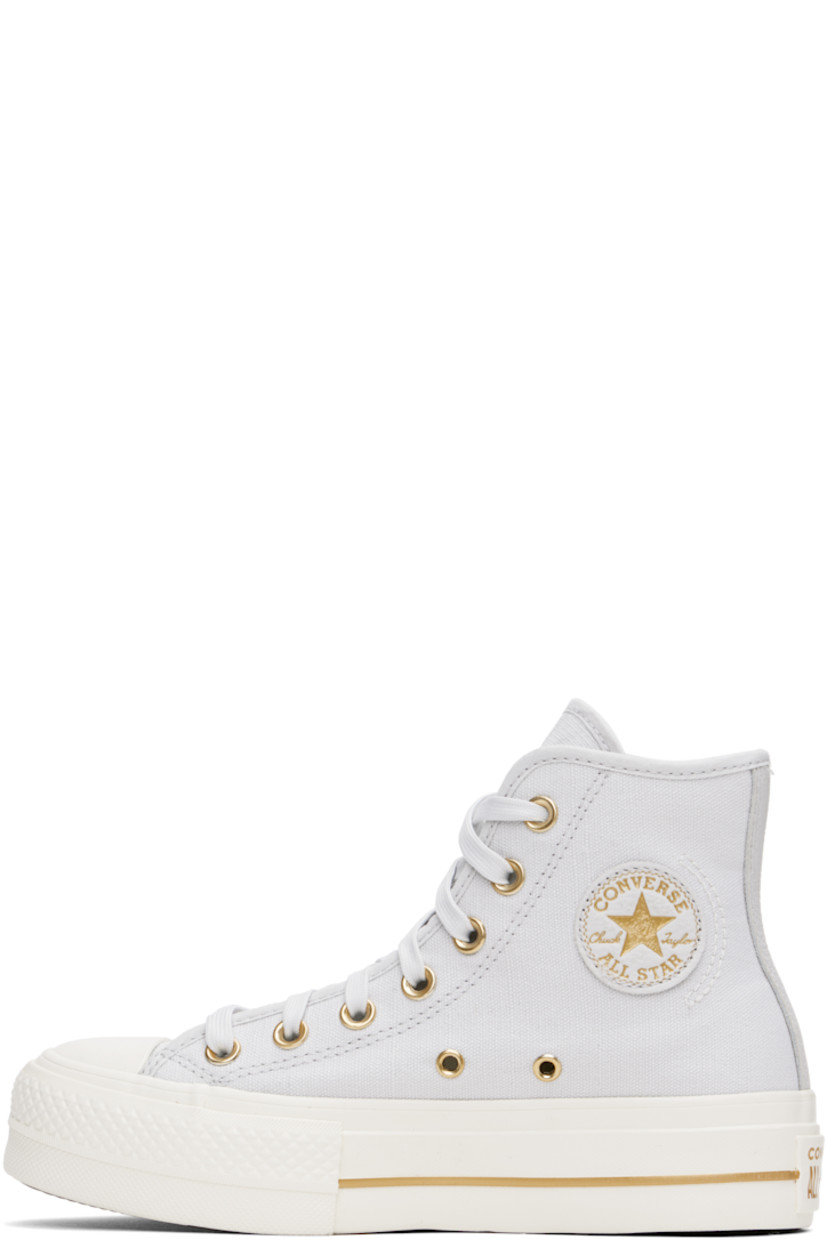 High-top canvas sneakers in gray.

· Rubber cap toe
· Lace-up closure
· Logo patch and eyelets at inner side
· Mesh lining
· OrthoLite cushioning insole
· Logo patch at heel
· Treaded rubber platform sole 
· Platform: H1.5"

Supplier color: Barely Grey/Egret/Gold