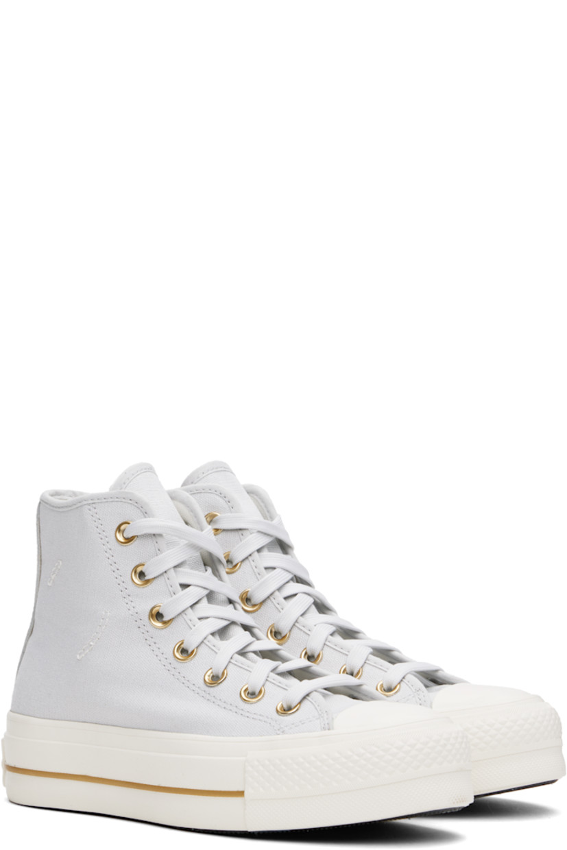 High-top canvas sneakers in gray.

· Rubber cap toe
· Lace-up closure
· Logo patch and eyelets at inner side
· Mesh lining
· OrthoLite cushioning insole
· Logo patch at heel
· Treaded rubber platform sole 
· Platform: H1.5"

Supplier color: Barely Grey/Egret/Gold
