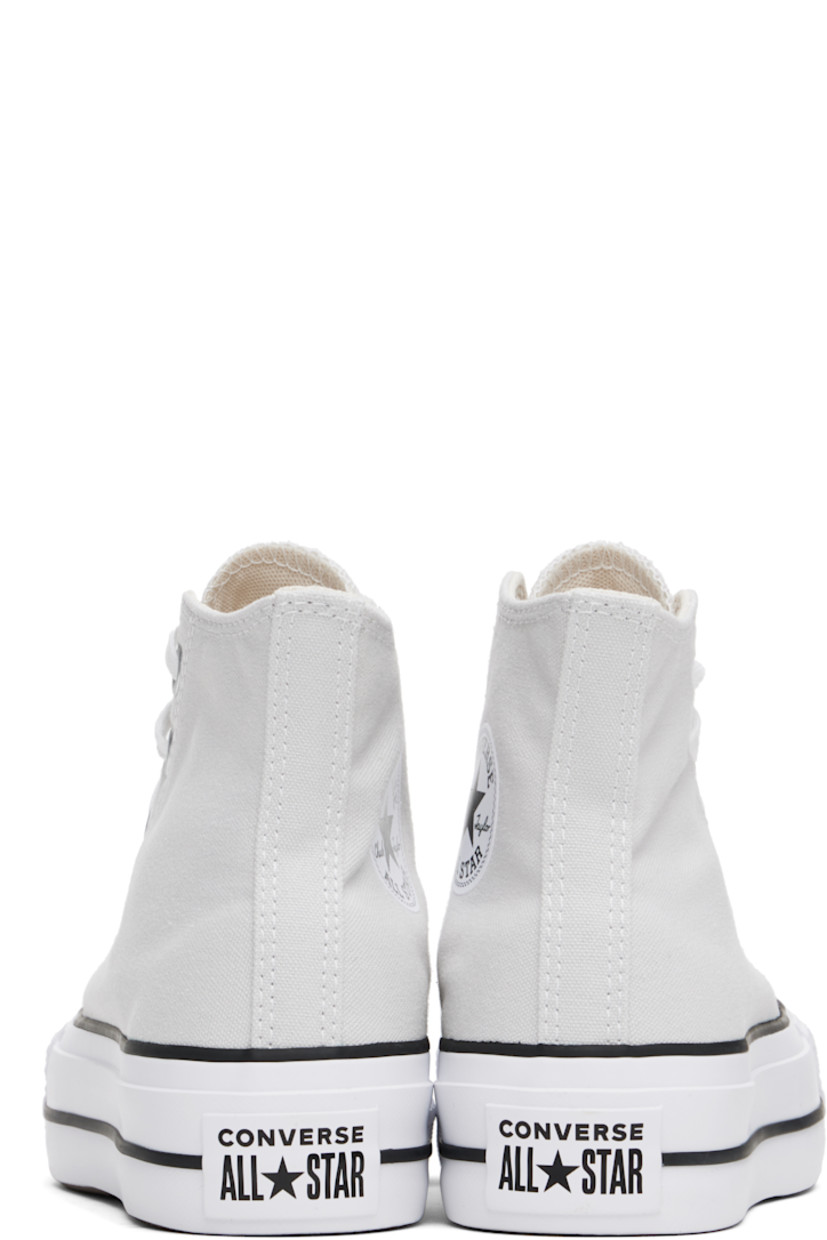 High-top canvas sneakers in gray.

· Rubber cap toe
· Lace-up closure
· Logo patch and eyelets at inner side
· Mesh lining
· OrthoLite cushioning insole
· Logo patch at heel
· Treaded rubber platform sole
· Platform: H1.5"

Supplier color: Barely Grey/White/Black