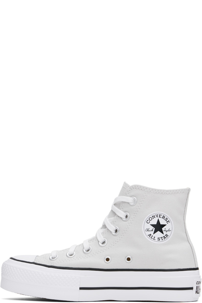 High-top canvas sneakers in gray.

· Rubber cap toe
· Lace-up closure
· Logo patch and eyelets at inner side
· Mesh lining
· OrthoLite cushioning insole
· Logo patch at heel
· Treaded rubber platform sole
· Platform: H1.5"

Supplier color: Barely Grey/White/Black