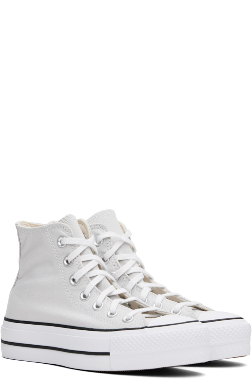 High-top canvas sneakers in gray.

· Rubber cap toe
· Lace-up closure
· Logo patch and eyelets at inner side
· Mesh lining
· OrthoLite cushioning insole
· Logo patch at heel
· Treaded rubber platform sole
· Platform: H1.5"

Supplier color: Barely Grey/White/Black