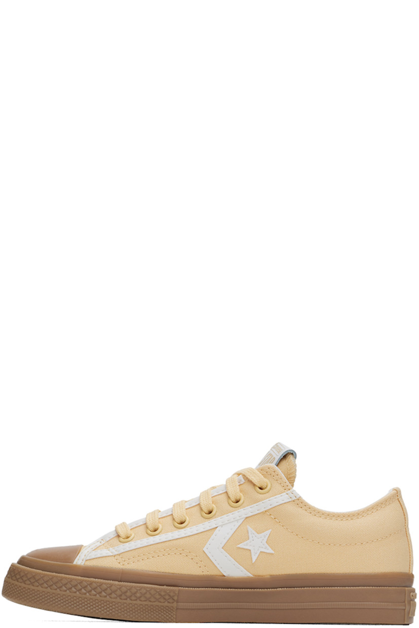 Low-top canvas sneakers in yellow.

· Buffed faux-leather trim throughout
· Rubber cap toe
· Lace-up closure
· Logo flag at tongue
· Padded collar
· Logo appliqué at sides
· Cushioned Ortholite® footbed
· Mesh lining
· Rubberized logo patch at heel
· Treaded rubber sole

Supplier color: Afternoon sun/Vintage white/Light gold