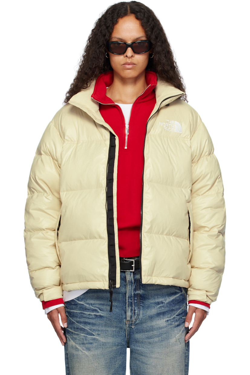 RDS-certified down-filled and quilted non-PFC DWR-coated recycled nylon ripstop jacket. Windproof, water-repellent, and abrasion-resistant.

· Packable
· Stowaway hood at funnel neck
· Concealed bungee-style drawstring at hood and hem
· Zip closure
· Logo embroidered at chest and back
· Zip pockets
· Packs into zip pocket
· Text embroidered at sleeve
· Velcro fastening at elasticized cuffs
· Triclimate® press-stud fastening at cuffs
· Zip pocket at interior
· Full nylon taffeta lining

Available exclusively at SSENSE.

Supplier color: Gravel shine

Fill: 85% down, 15% waterfowl feathers.