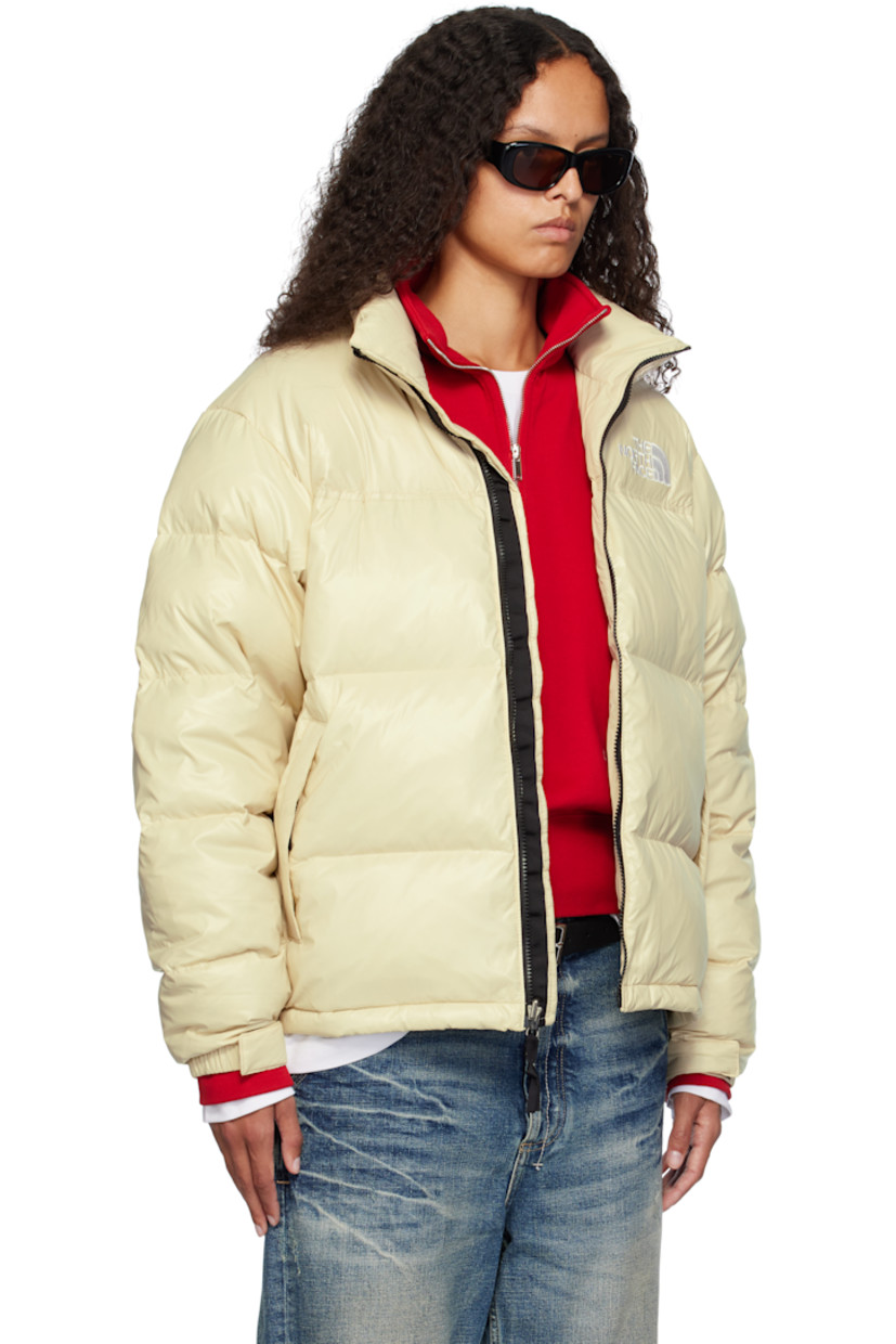 RDS-certified down-filled and quilted non-PFC DWR-coated recycled nylon ripstop jacket. Windproof, water-repellent, and abrasion-resistant.

· Packable
· Stowaway hood at funnel neck
· Concealed bungee-style drawstring at hood and hem
· Zip closure
· Logo embroidered at chest and back
· Zip pockets
· Packs into zip pocket
· Text embroidered at sleeve
· Velcro fastening at elasticized cuffs
· Triclimate® press-stud fastening at cuffs
· Zip pocket at interior
· Full nylon taffeta lining

Available exclusively at SSENSE.

Supplier color: Gravel shine

Fill: 85% down, 15% waterfowl feathers.