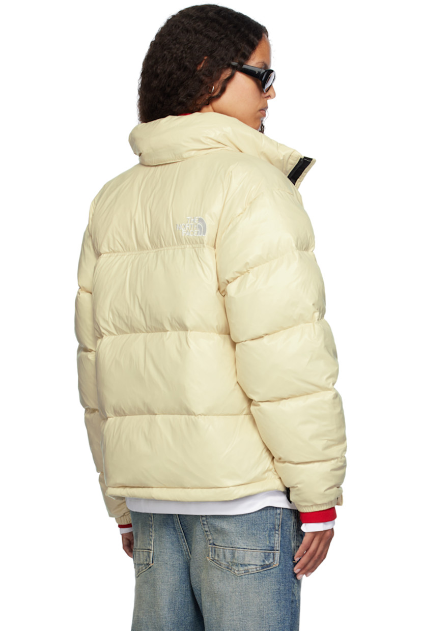 RDS-certified down-filled and quilted non-PFC DWR-coated recycled nylon ripstop jacket. Windproof, water-repellent, and abrasion-resistant.

· Packable
· Stowaway hood at funnel neck
· Concealed bungee-style drawstring at hood and hem
· Zip closure
· Logo embroidered at chest and back
· Zip pockets
· Packs into zip pocket
· Text embroidered at sleeve
· Velcro fastening at elasticized cuffs
· Triclimate® press-stud fastening at cuffs
· Zip pocket at interior
· Full nylon taffeta lining

Available exclusively at SSENSE.

Supplier color: Gravel shine

Fill: 85% down, 15% waterfowl feathers.