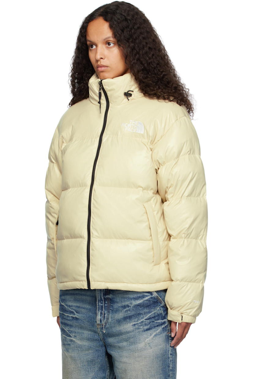 RDS-certified down-filled and quilted non-PFC DWR-coated recycled nylon ripstop jacket. Windproof, water-repellent, and abrasion-resistant.

· Packable
· Stowaway hood at funnel neck
· Concealed bungee-style drawstring at hood and hem
· Zip closure
· Logo embroidered at chest and back
· Zip pockets
· Packs into zip pocket
· Text embroidered at sleeve
· Velcro fastening at elasticized cuffs
· Triclimate® press-stud fastening at cuffs
· Zip pocket at interior
· Full nylon taffeta lining

Available exclusively at SSENSE.

Supplier color: Gravel shine

Fill: 85% down, 15% waterfowl feathers.