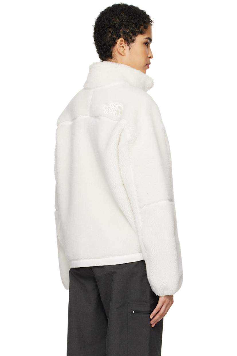 Sherpa fleece jacket. Overlock stitching throughout.

· Funnel neck
· Zip closure
· Logo embroidered at chest and back
· Zip pockets
· Cord-lock drawstring at hem
· Elasticized cuffs

Supplier color: White dune