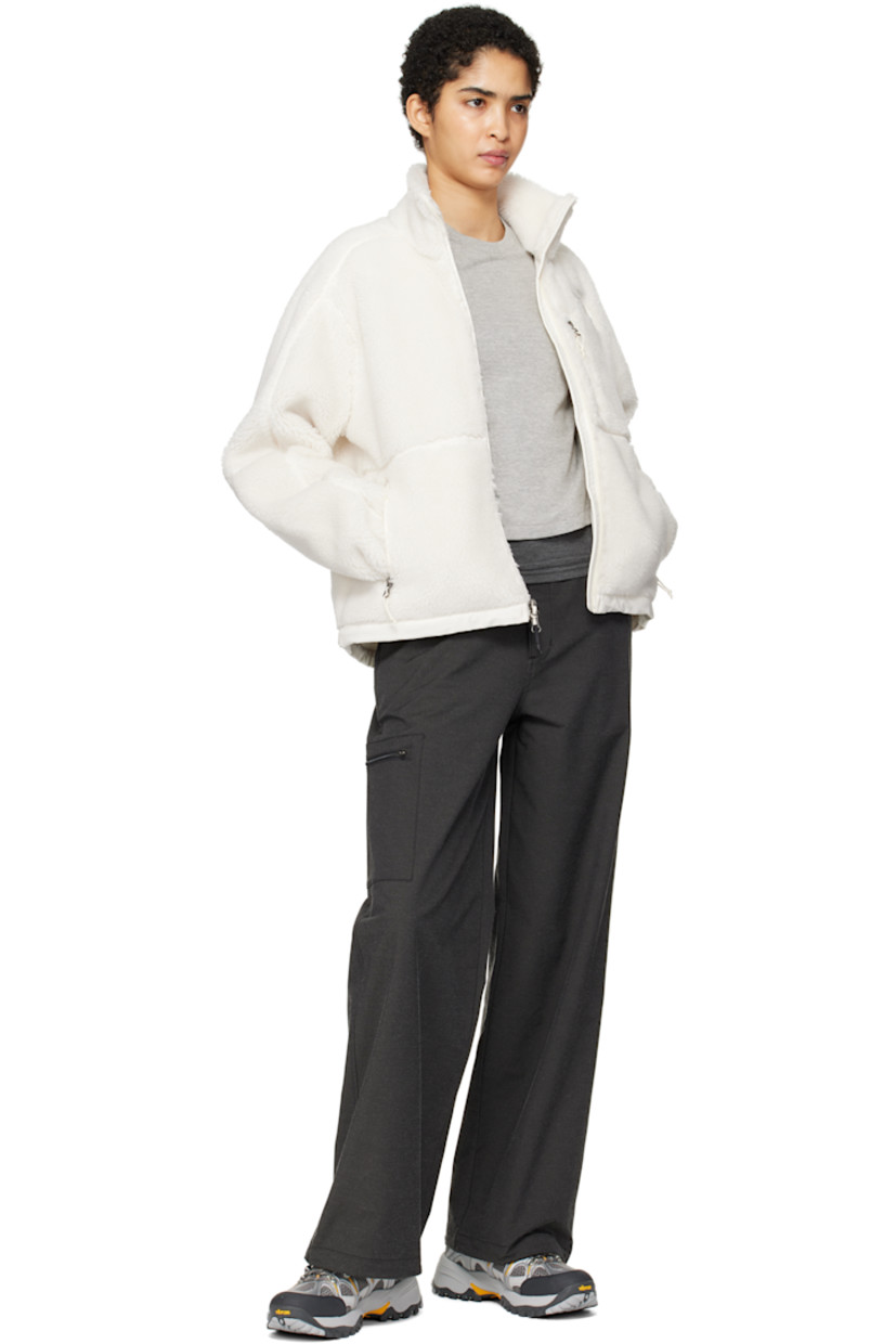 Sherpa fleece jacket. Overlock stitching throughout.

· Funnel neck
· Zip closure
· Logo embroidered at chest and back
· Zip pockets
· Cord-lock drawstring at hem
· Elasticized cuffs

Supplier color: White dune
