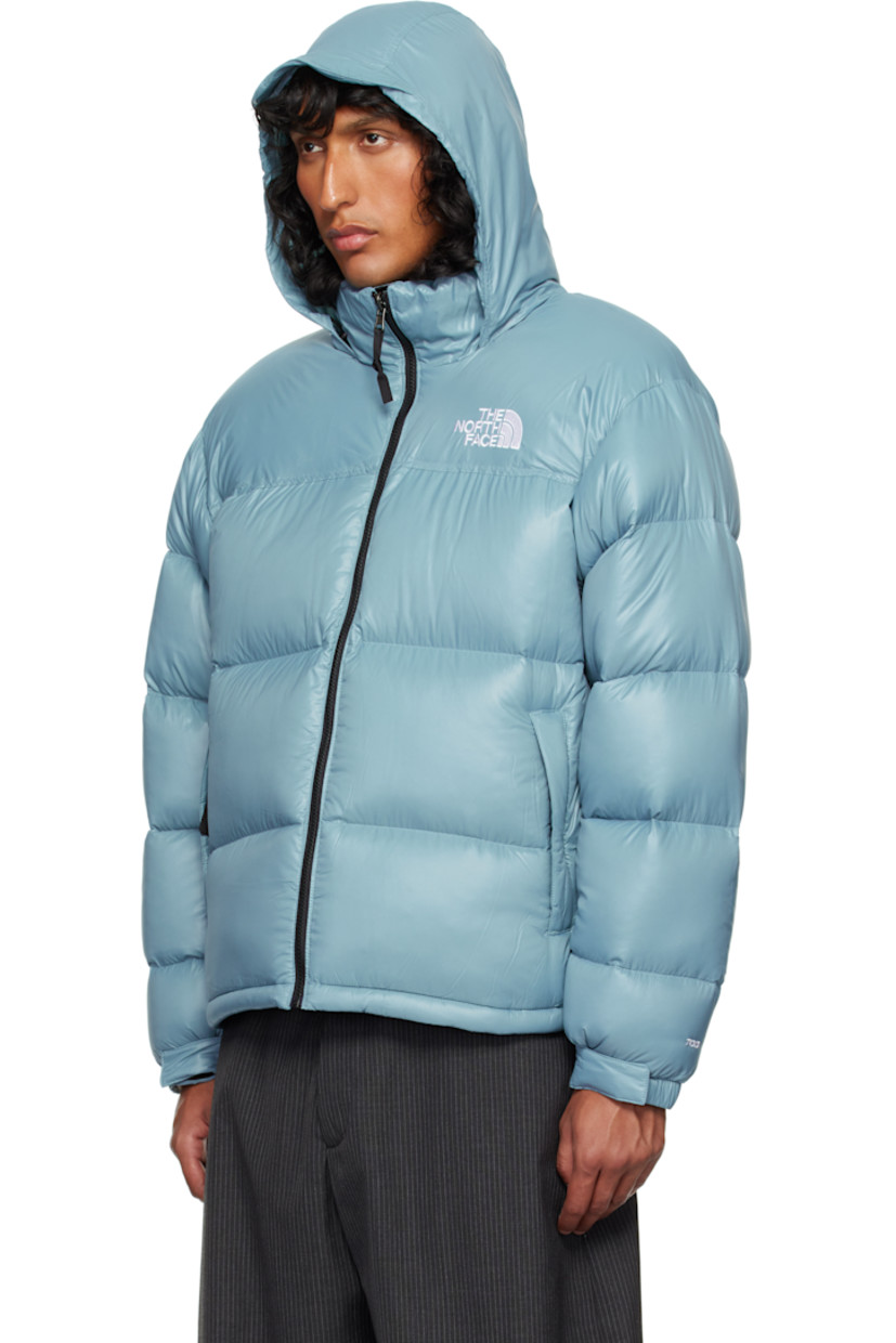 RDS-certified down-filled and quilted non-PFC DWR-coated recycled nylon ripstop jacket. Windproof, water-repellent, and abrasion-resistant.

· Packable
· Stowaway hood at funnel neck
· Concealed bungee-style drawstring at hood and hem
· Zip closure
· Logo embroidered at chest and back
· Zip pockets
· Packs into zip pocket
· Text embroidered at sleeve
· Velcro fastening at elasticized cuffs
· Triclimate® press-stud fastening at cuffs
· Zip pocket at interior
· Full nylon taffeta lining

Available exclusively at SSENSE.

Supplier color: Algae blue shine

Fill: 85% down, 15% waterfowl feathers.