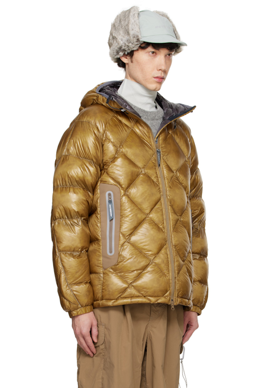 Packable down-filled and quilted Pertex Quantum nylon ripstop jacket. Lightweight, windproof, and water-resistant.

· Reflective trim throughout
· Elasticized drawstring at hood
· Two-way zip closure
· Zip pockets
· Concealed bungee-style drawstring at hem
· Raglan sleeves
· Logo bonded at sleeve
· Elasticized cuffs
· Faux-fur lining at collar

Supplier color: Camel

Fill: 90% down, 10% feather.