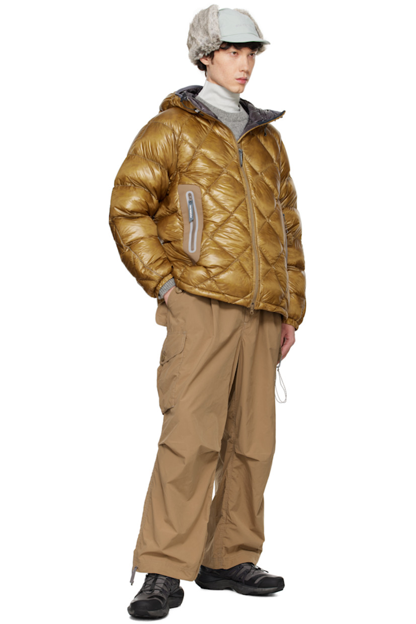 Packable down-filled and quilted Pertex Quantum nylon ripstop jacket. Lightweight, windproof, and water-resistant.

· Reflective trim throughout
· Elasticized drawstring at hood
· Two-way zip closure
· Zip pockets
· Concealed bungee-style drawstring at hem
· Raglan sleeves
· Logo bonded at sleeve
· Elasticized cuffs
· Faux-fur lining at collar

Supplier color: Camel

Fill: 90% down, 10% feather.