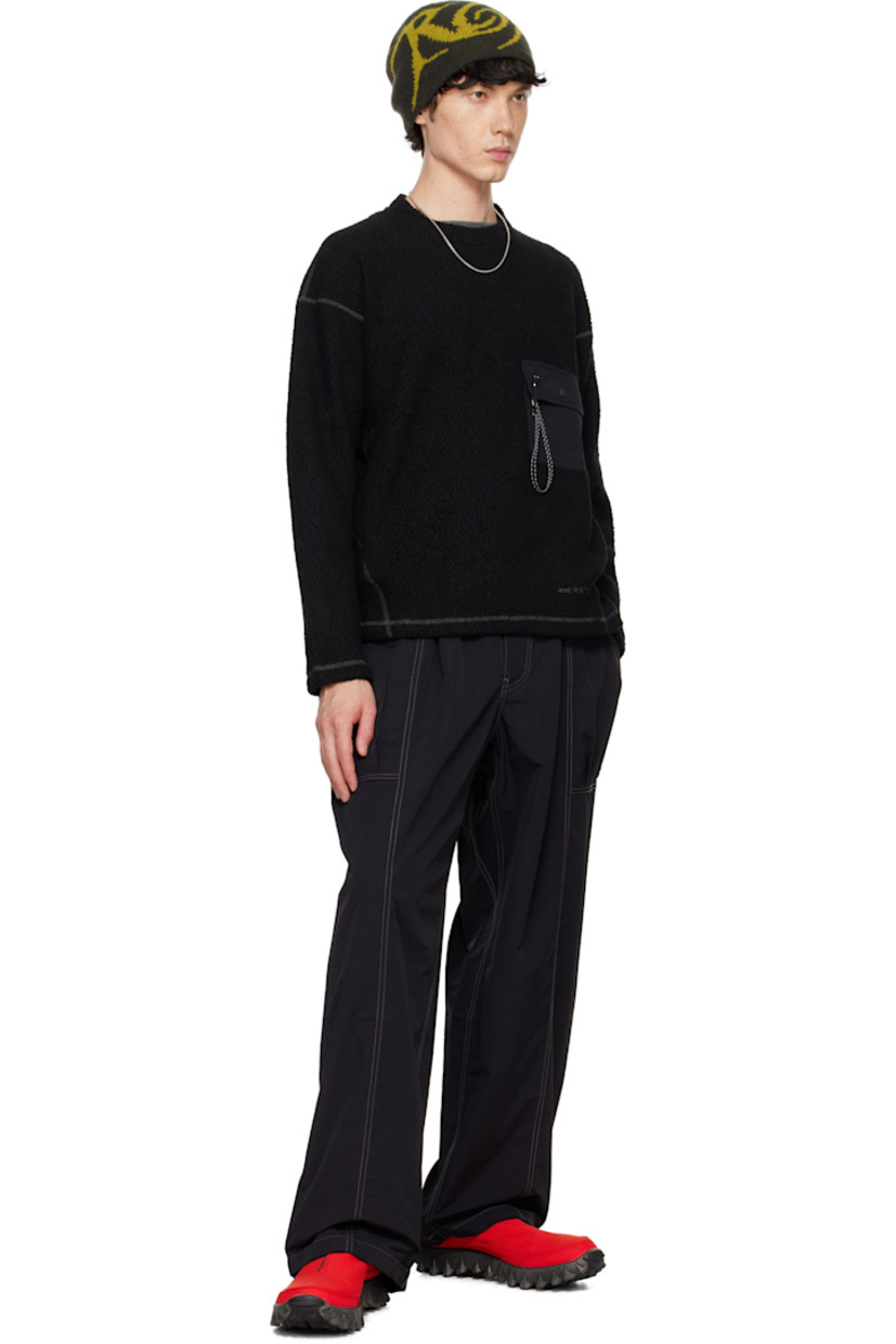 Knit wool-blend sweater. Jacquard pattern throughout.

· Paneled construction
· Crewneck
· Flap pocket with carabiner at chest 
· Reflective bonded logo at front
· Dropped shoulders
· Logo-embossed locker loop at back collar

Supplier color: Black