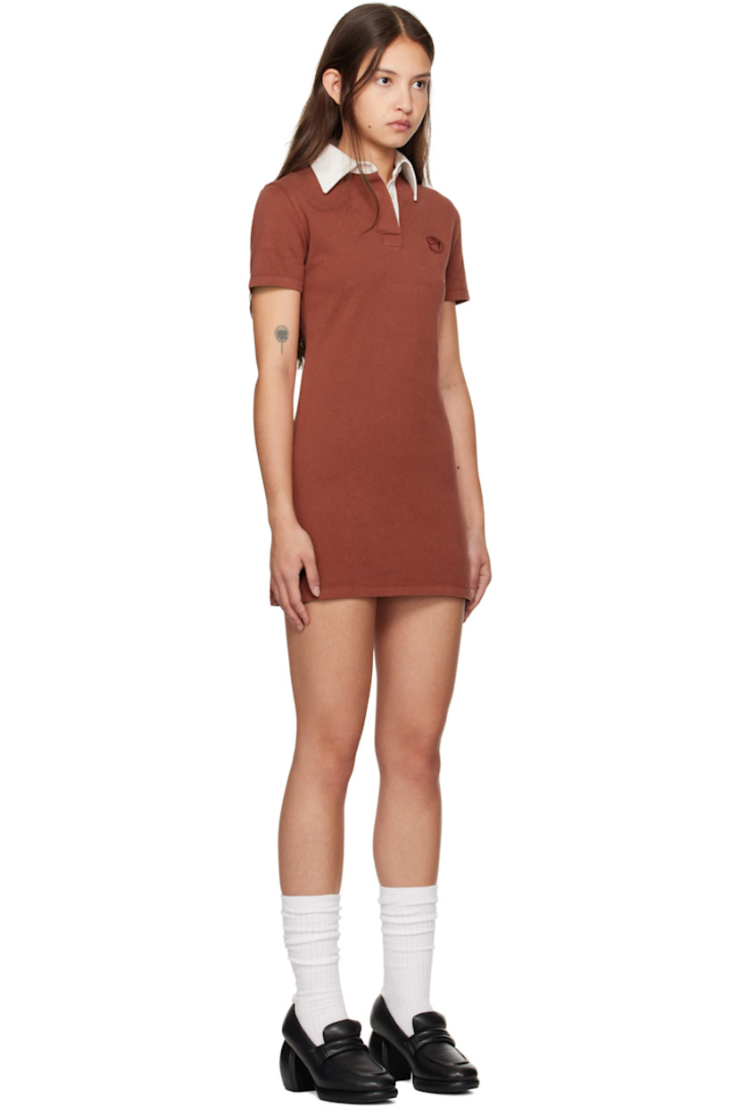 Cotton jersey minidress. 

· Twill spread collar
· Concealed three-button placket
· Logo embroidered at chest
· Vented side seams
· Graphic appliqué at back
· Mother-of-pearl hardware

Supplier color: Russet brown