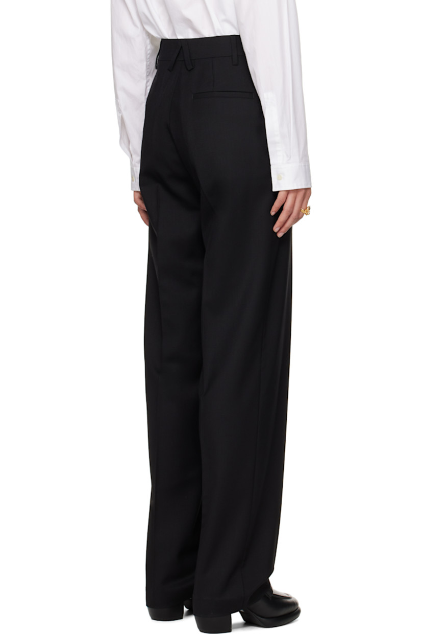 Stretch virgin wool twill trousers. 

· Belt loops
· Three-pocket styling
· Zip-fly
· Creased legs
· Partial viscose satin lining

Supplier color: Black