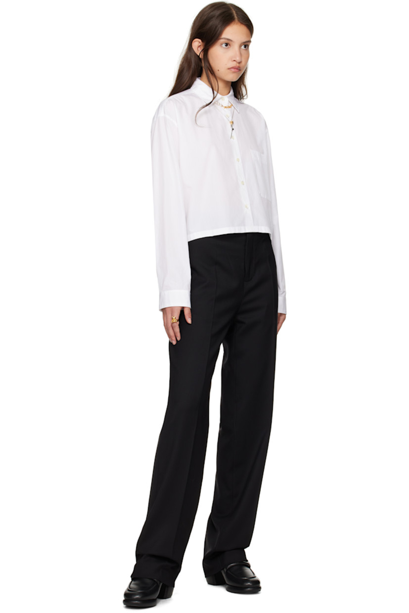 Stretch virgin wool twill trousers. 

· Belt loops
· Three-pocket styling
· Zip-fly
· Creased legs
· Partial viscose satin lining

Supplier color: Black