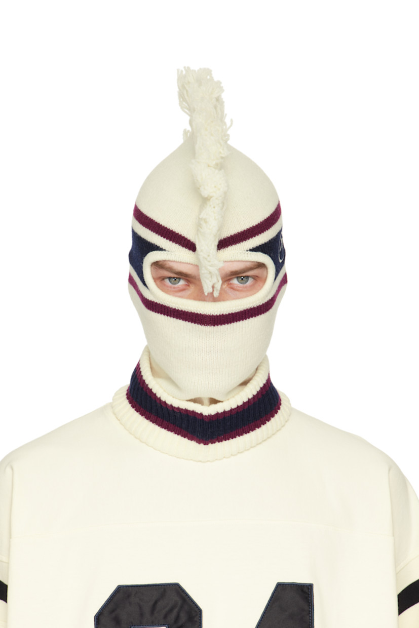 Knit virgin wool balaclava in off-white, burgundy, and navy.

· Jacquard stripes throughout
· Fringed trim at crown
· Rolled rib-knit collar
· Logo embroidered at side

Face masks and face coverings are final sale and are not eligible for return or exchange.

Supplier color: White