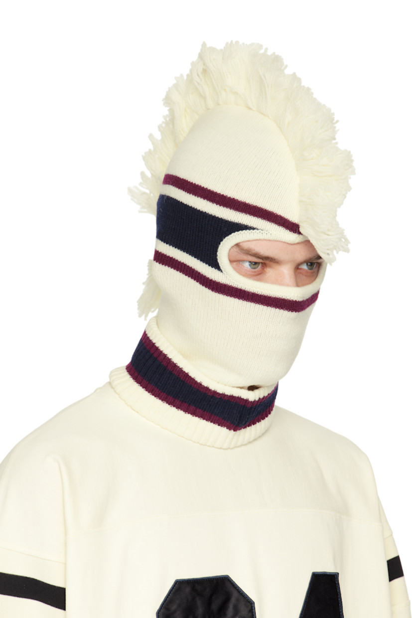 Knit virgin wool balaclava in off-white, burgundy, and navy.

· Jacquard stripes throughout
· Fringed trim at crown
· Rolled rib-knit collar
· Logo embroidered at side

Face masks and face coverings are final sale and are not eligible for return or exchange.

Supplier color: White