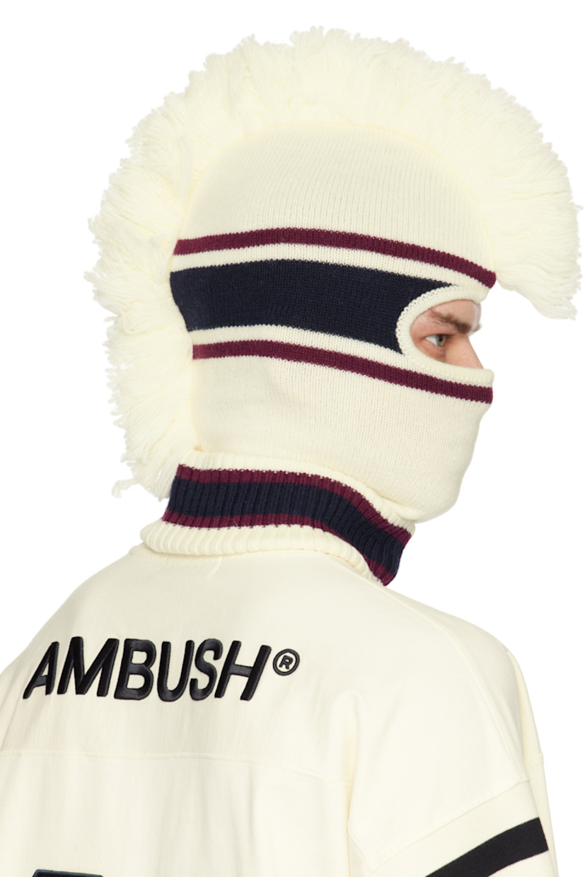 Knit virgin wool balaclava in off-white, burgundy, and navy.

· Jacquard stripes throughout
· Fringed trim at crown
· Rolled rib-knit collar
· Logo embroidered at side

Face masks and face coverings are final sale and are not eligible for return or exchange.

Supplier color: White