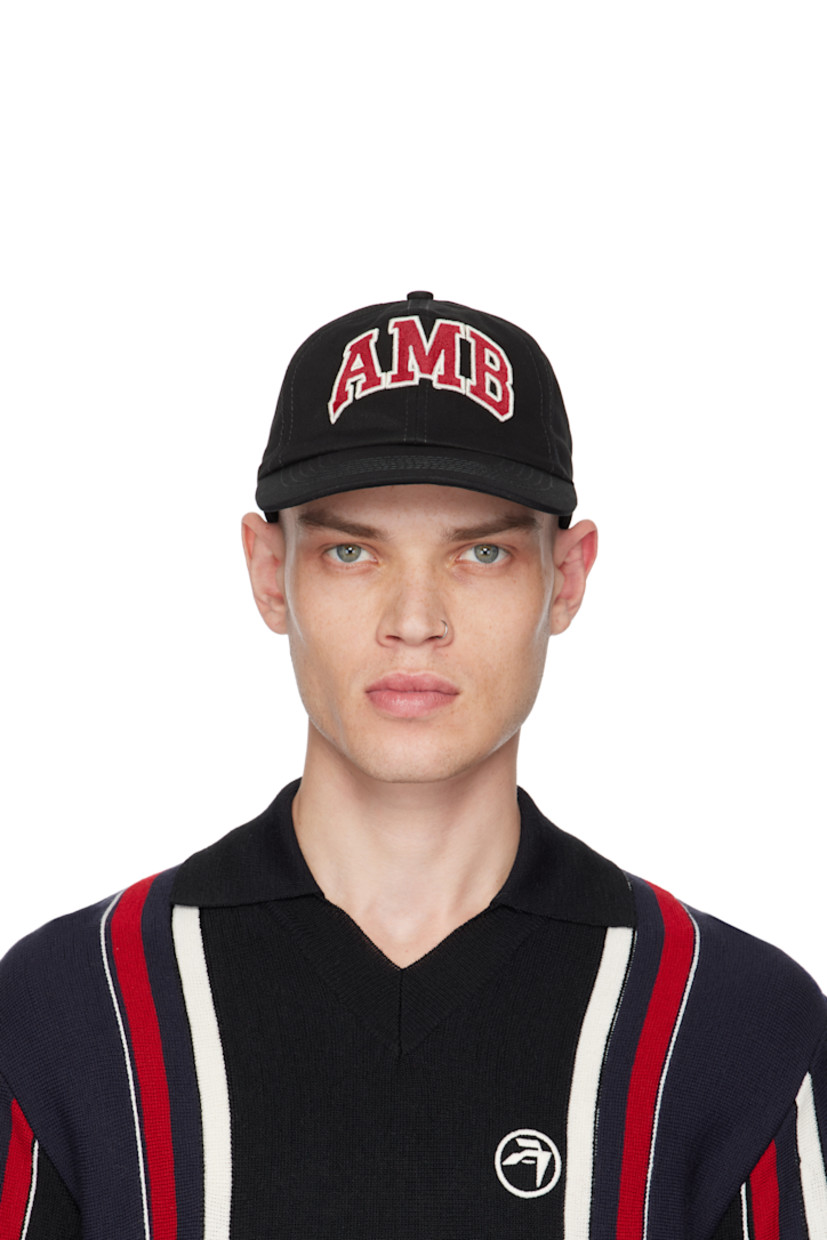 Cotton twill cap in black.

· Embroidered eyelets at crown
· Logo graphic appliqués at face
· Curved brim
· Cinch strap
· Twill browband
· Partially lined

Supplier color: Black
