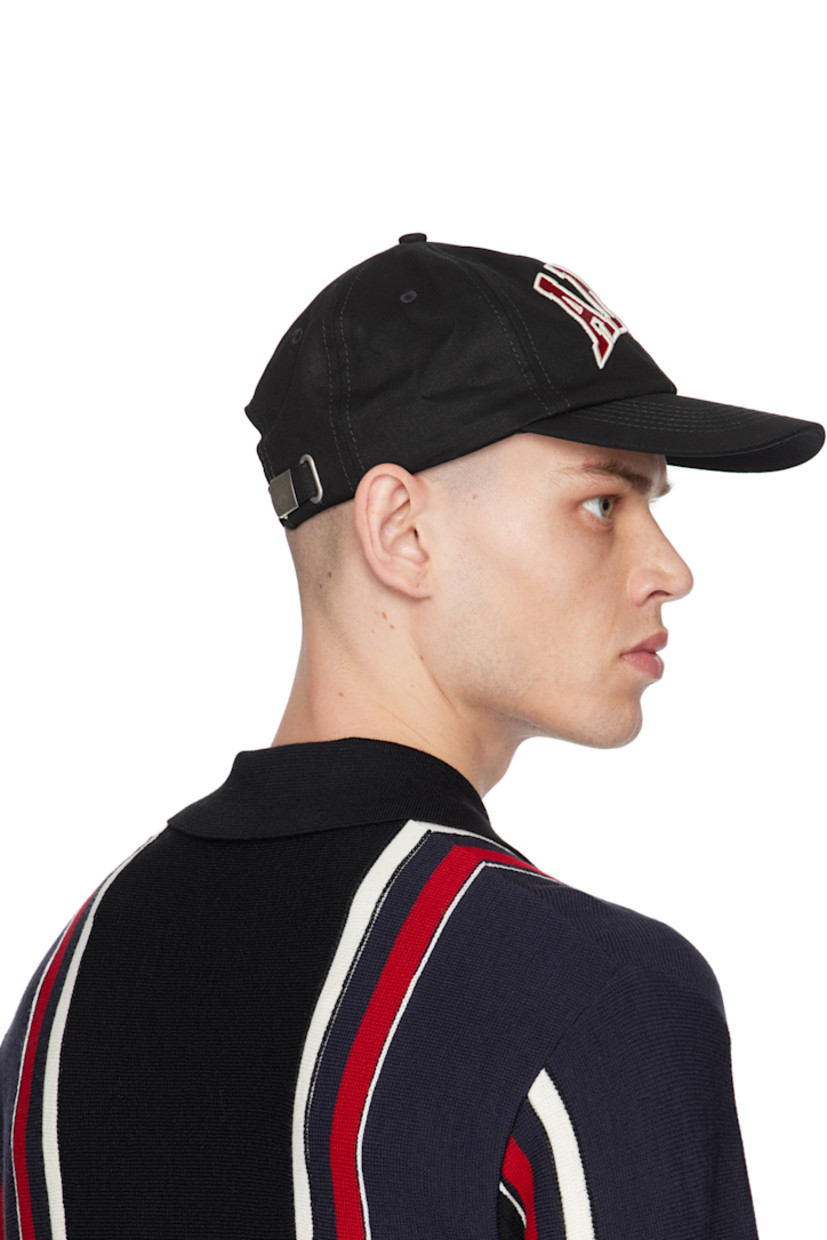 Cotton twill cap in black.

· Embroidered eyelets at crown
· Logo graphic appliqués at face
· Curved brim
· Cinch strap
· Twill browband
· Partially lined

Supplier color: Black
