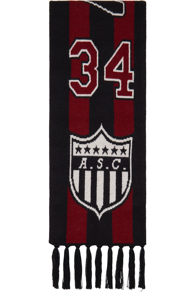 Rectangular knit alpaca-blend scarf in burgundy and black.

· Stripes and logo graphics throughout
· Fringed detailing at ends
· L56" x W7.4"

Supplier color: Burgundy