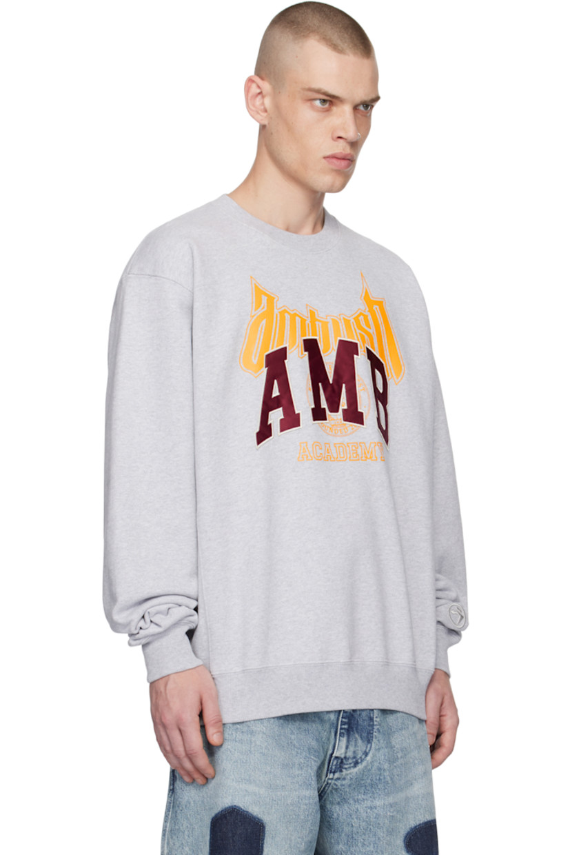 French terry sweatshirt.

· Rib-knit crewneck, hem, and cuffs
· Logo graphic printed at front
· Embroidered logo appliqués at chest 
· Dropped shoulders
· Logo embroidered at sleeve

Supplier color: Grey melange tap shoe