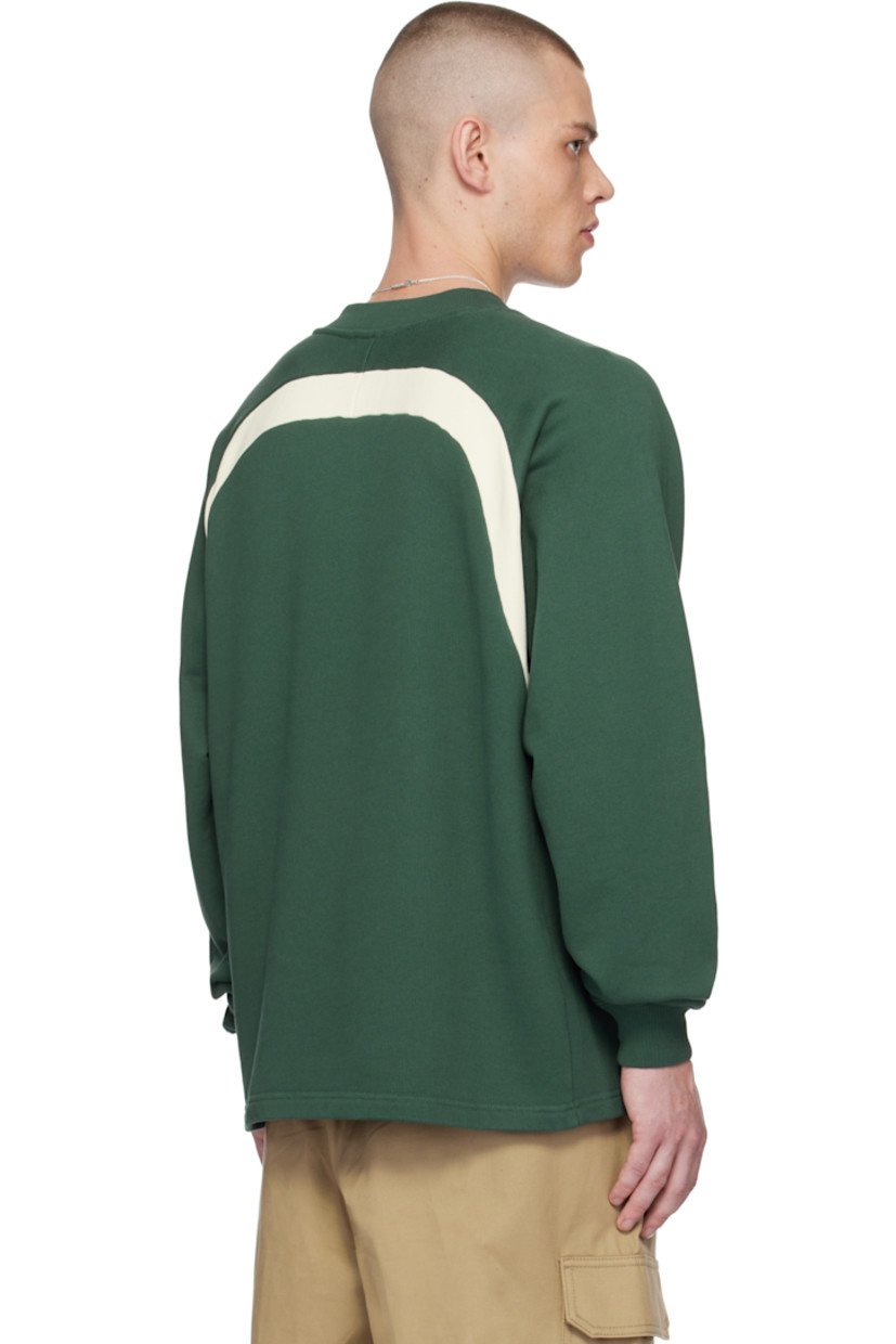 French terry sweatshirt.

· Paneled construction 
· Rib-knit V-neck and cuffs
· Logo embroidered at chest
· Welt pockets
· Raglan sleeves

Supplier color: Green