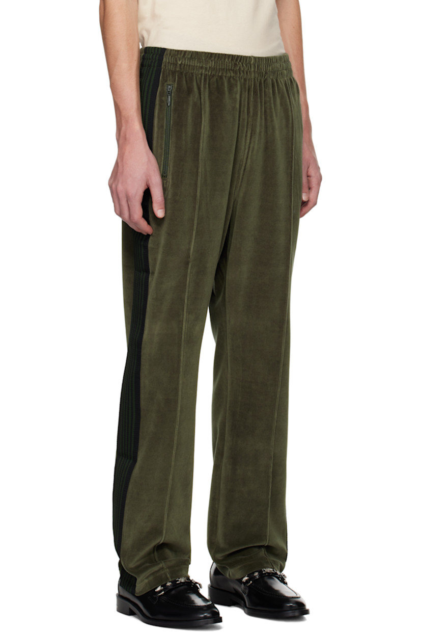 Cotton-blend velour track pants.

· Concealed drawstring at elasticized waistband
· Three-pocket styling
· Logo embroidered at front
· Pinched seam at front legs
· Striped knit trim at outseams

Supplier color: Olive