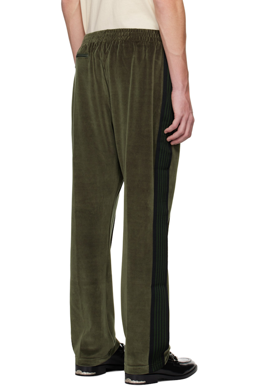 Cotton-blend velour track pants.

· Concealed drawstring at elasticized waistband
· Three-pocket styling
· Logo embroidered at front
· Pinched seam at front legs
· Striped knit trim at outseams

Supplier color: Olive