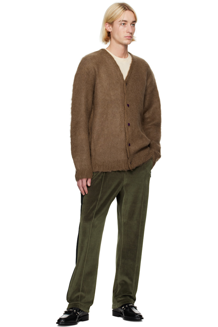 Cotton-blend velour track pants.

· Concealed drawstring at elasticized waistband
· Three-pocket styling
· Logo embroidered at front
· Pinched seam at front legs
· Striped knit trim at outseams

Supplier color: Olive